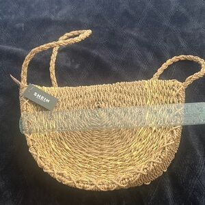 Paper straw bag, natural color with gold trim detail.